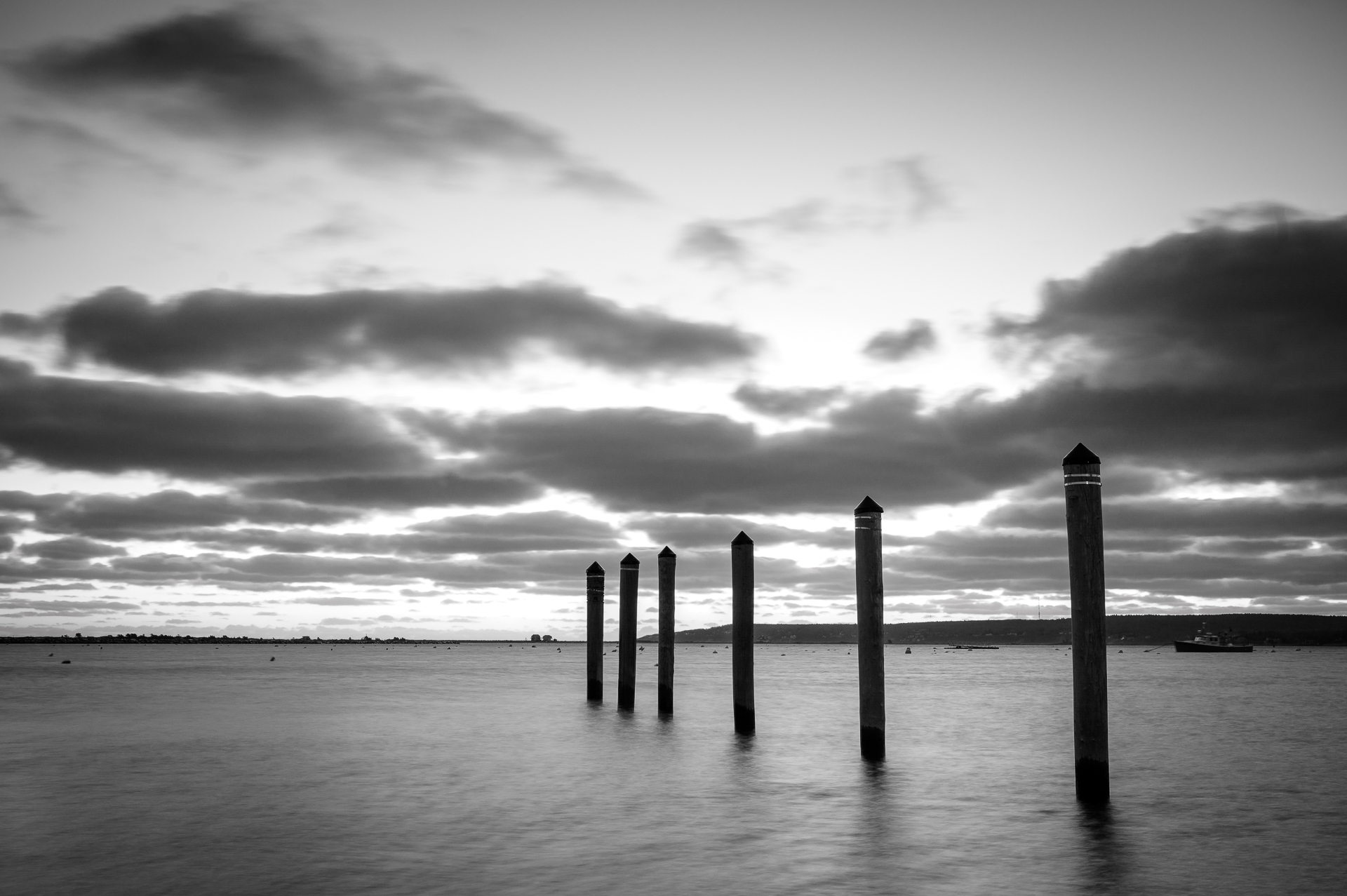 A Long exposure photo of dock pilings.