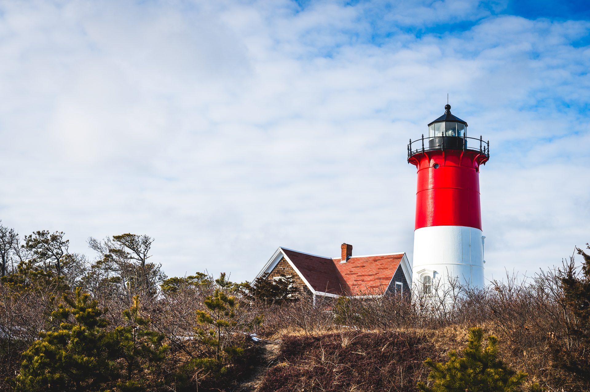 Nauset Light standing tall against clear blue skies.