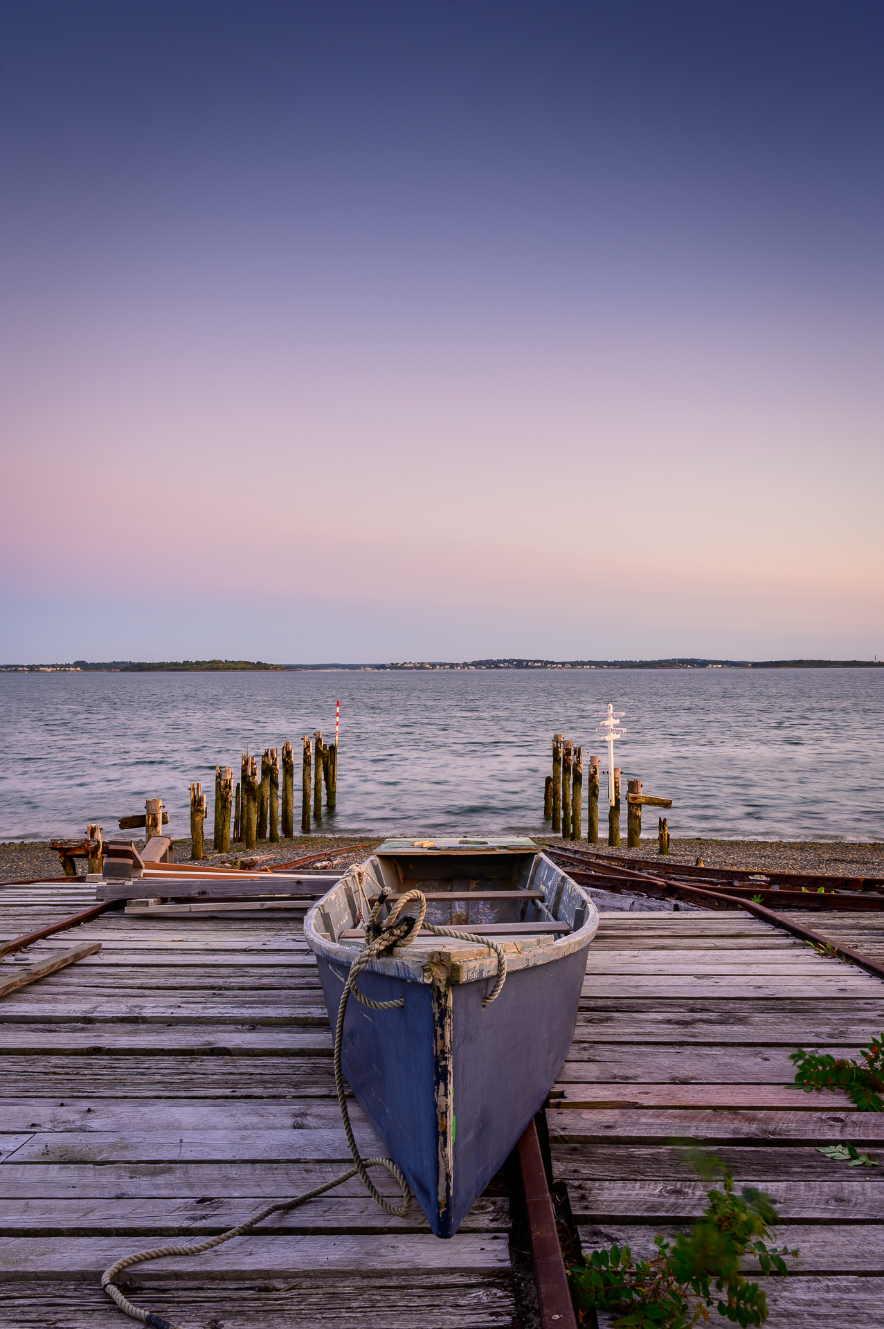 A boat ready for launch at a marina dock.