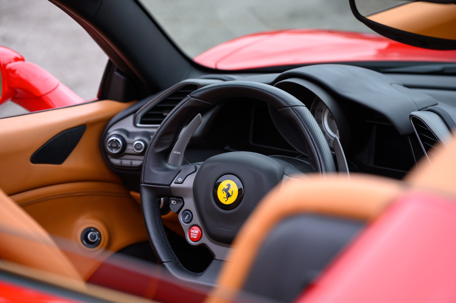 The interior of a Ferrari 488 Spyder at the Boch Exotics Cars and Coffee car show.