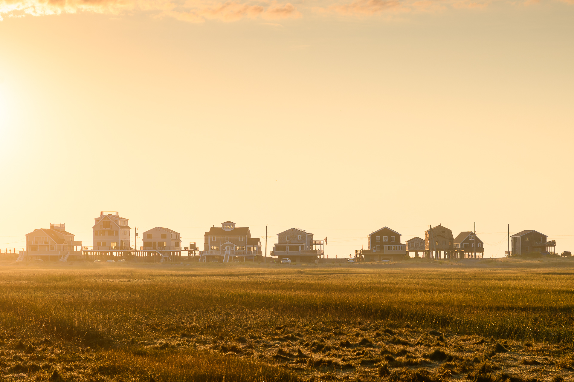 Houses on stilts at sunrise.