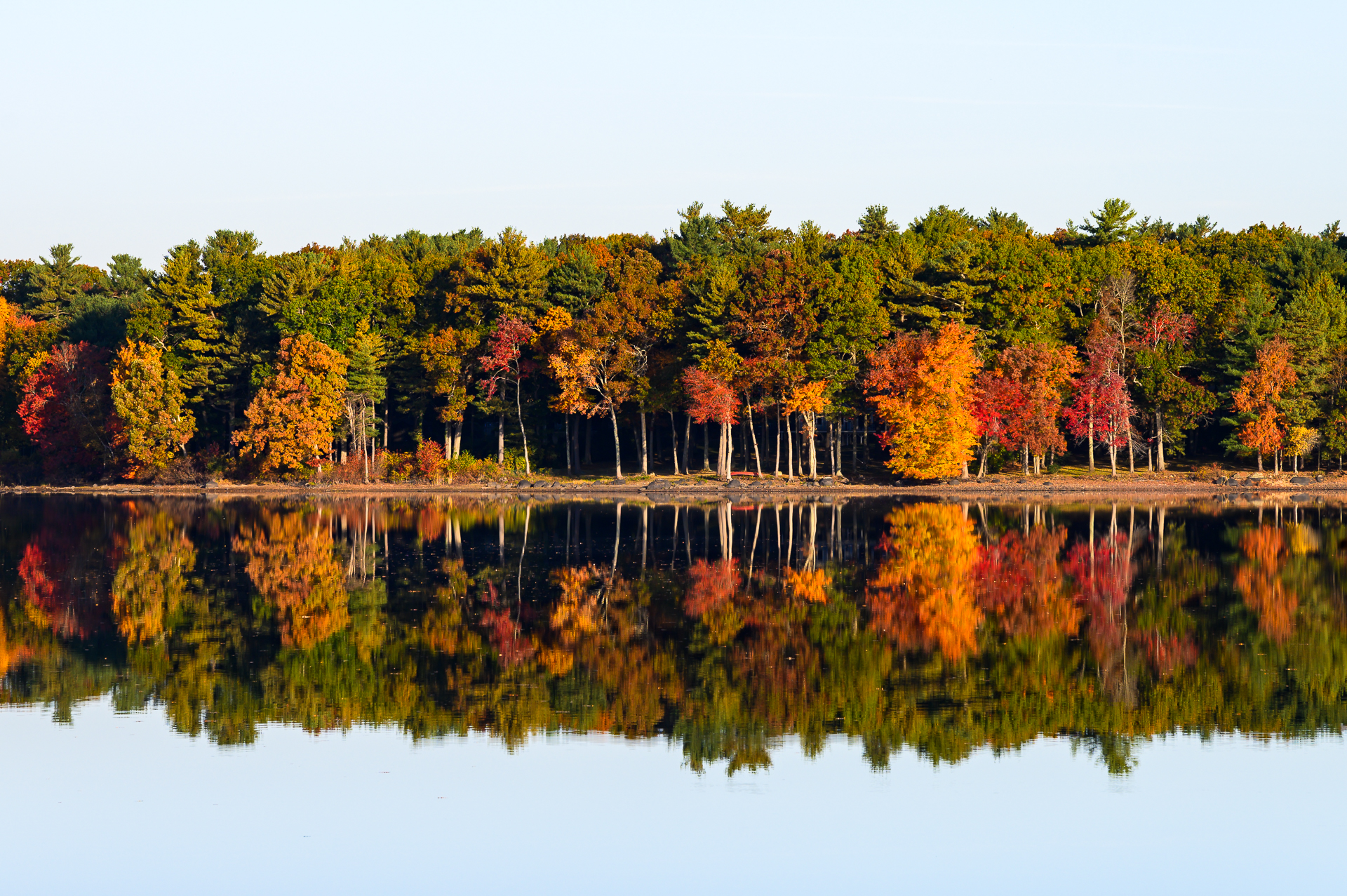 Autumn colors reflecting in Accord Pond in Hingham, MA.