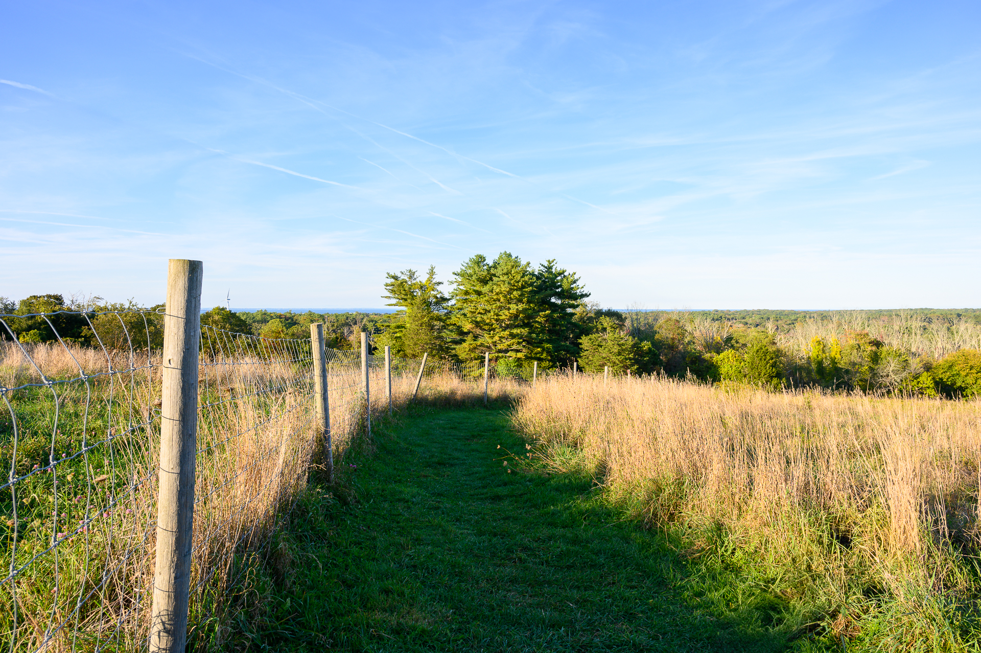 A path along a fence at Turkey Hill in Hingham, MA.