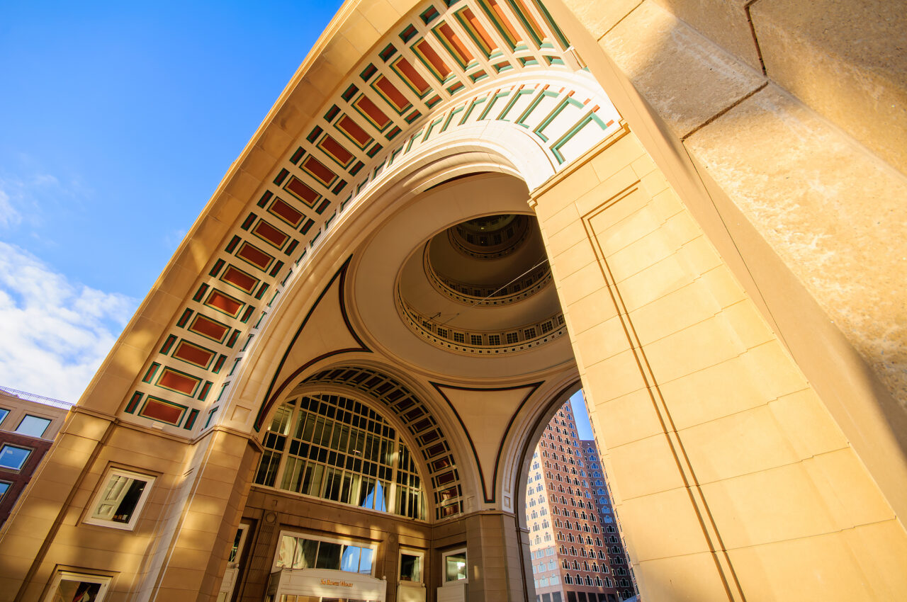 A close up wide angle view of the iconic arch of the Boston Harbor Hotel.