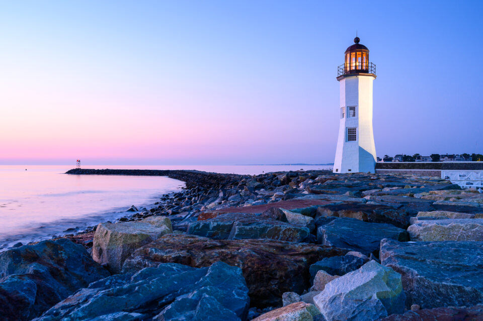 Scituate Lighthouse at blue hour in Scituate, Massachusetts, surrounded by soft twilight hues.