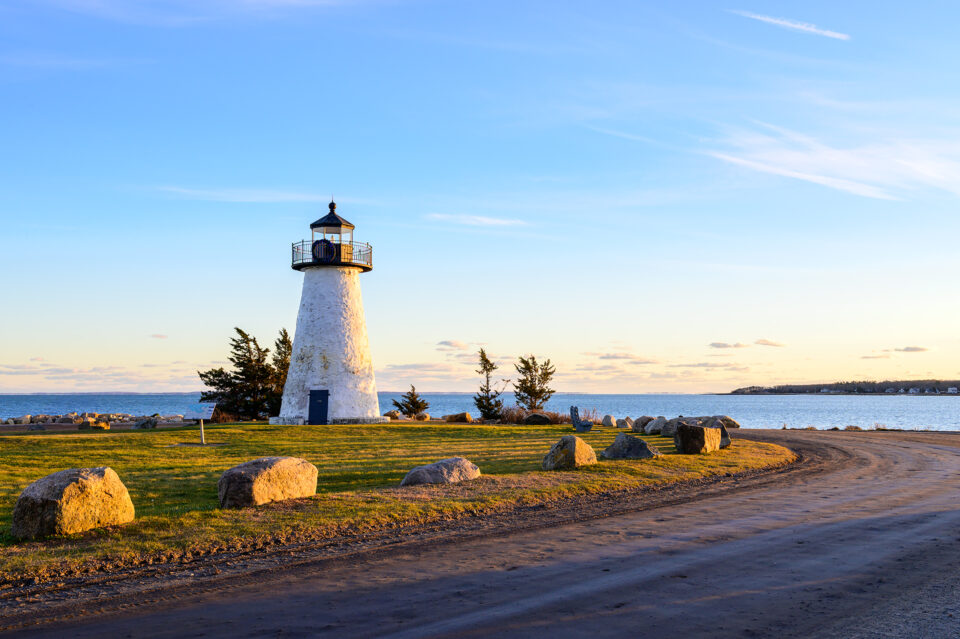 A road leading to Ned’s Point Lighthouse, with a row of rocks guiding the way.