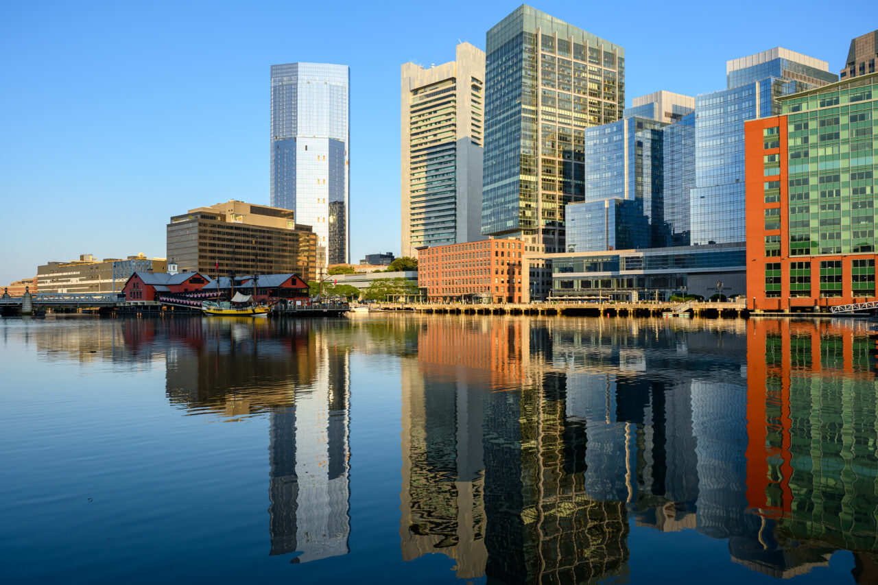 Boston Tea Party Museum building along the Fort Point Channel waterfront in early morning light.