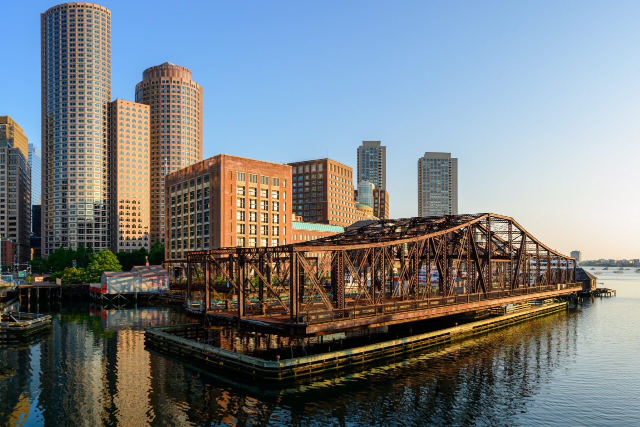 Abandoned Northern Avenue Bridge with rusted steel trusses spanning Fort Point Channel in Boston.