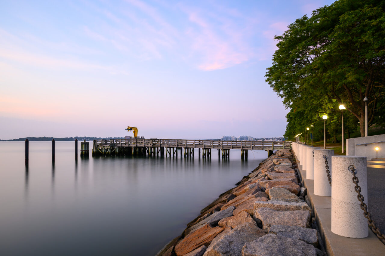 The John T. Fallon State Pier, located behind the JFK Library and Museum in Boston, at sunrise.