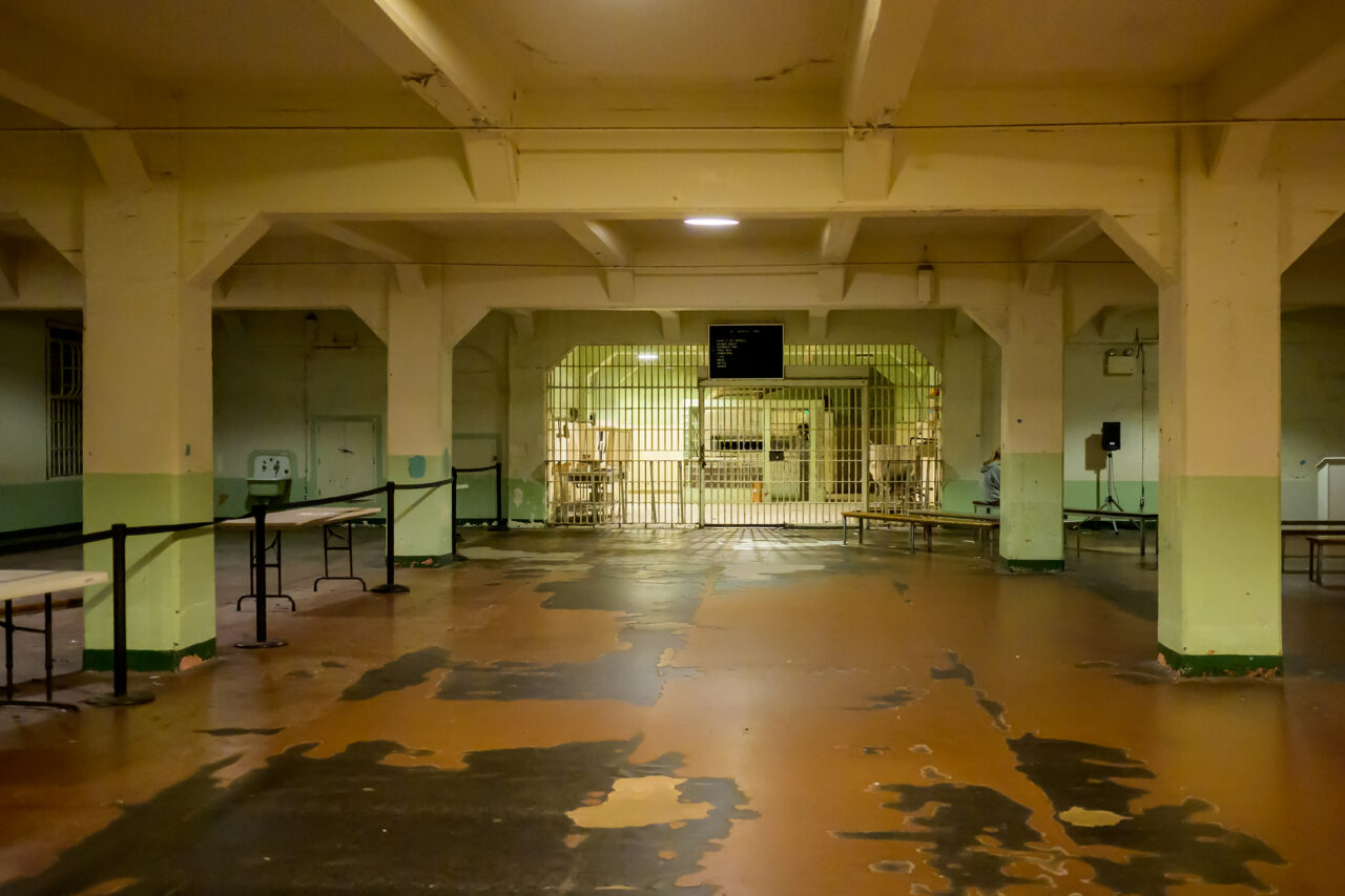 The eerie, dimly lit dining hall at Alcatraz during a night tour.