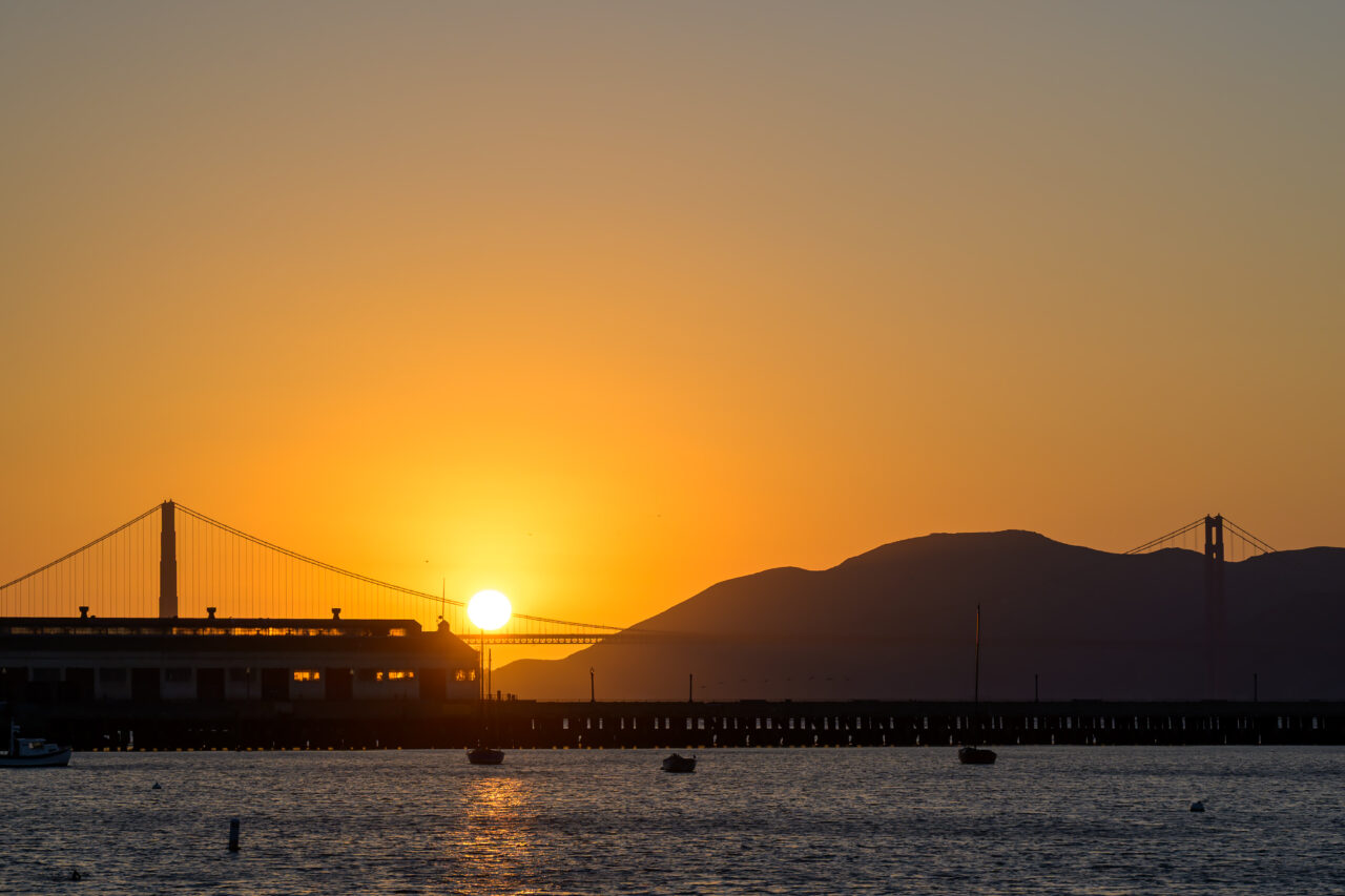 A golden sunset over the Golden Gate Bridge, as viewed from Aquatic Cove.