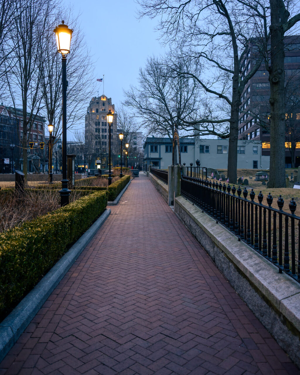 Early Hours in Quincy Square with a quiet pedestrian path under overcast morning skies.