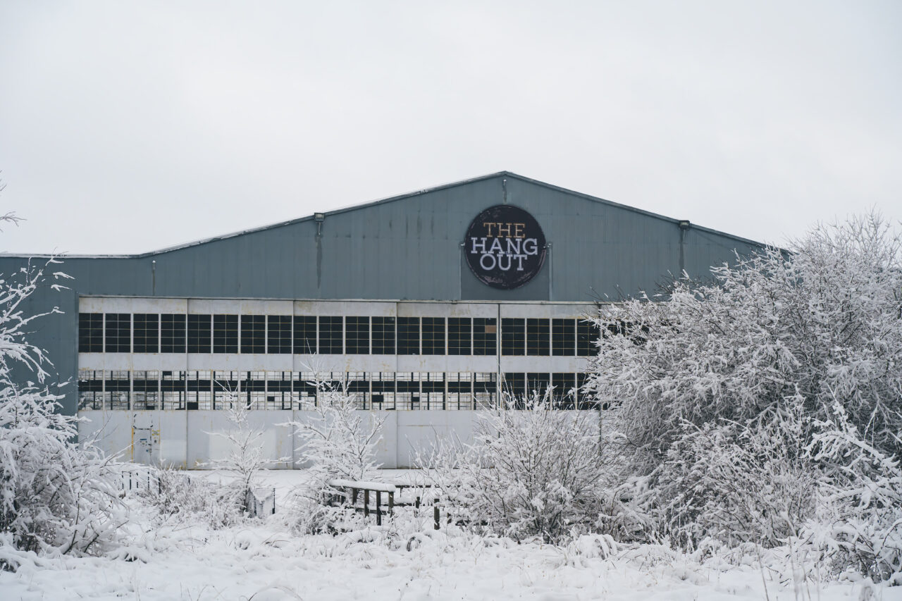 The “Hangout” building at Weymouth’s old naval base sits quietly among thick, snow-covered bushes after the January 19, 2026 snowstorm.