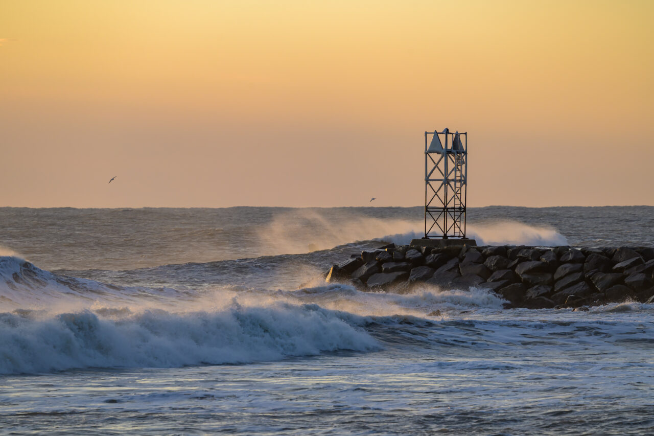 Golden morning light over the rough Atlantic in Scituate.