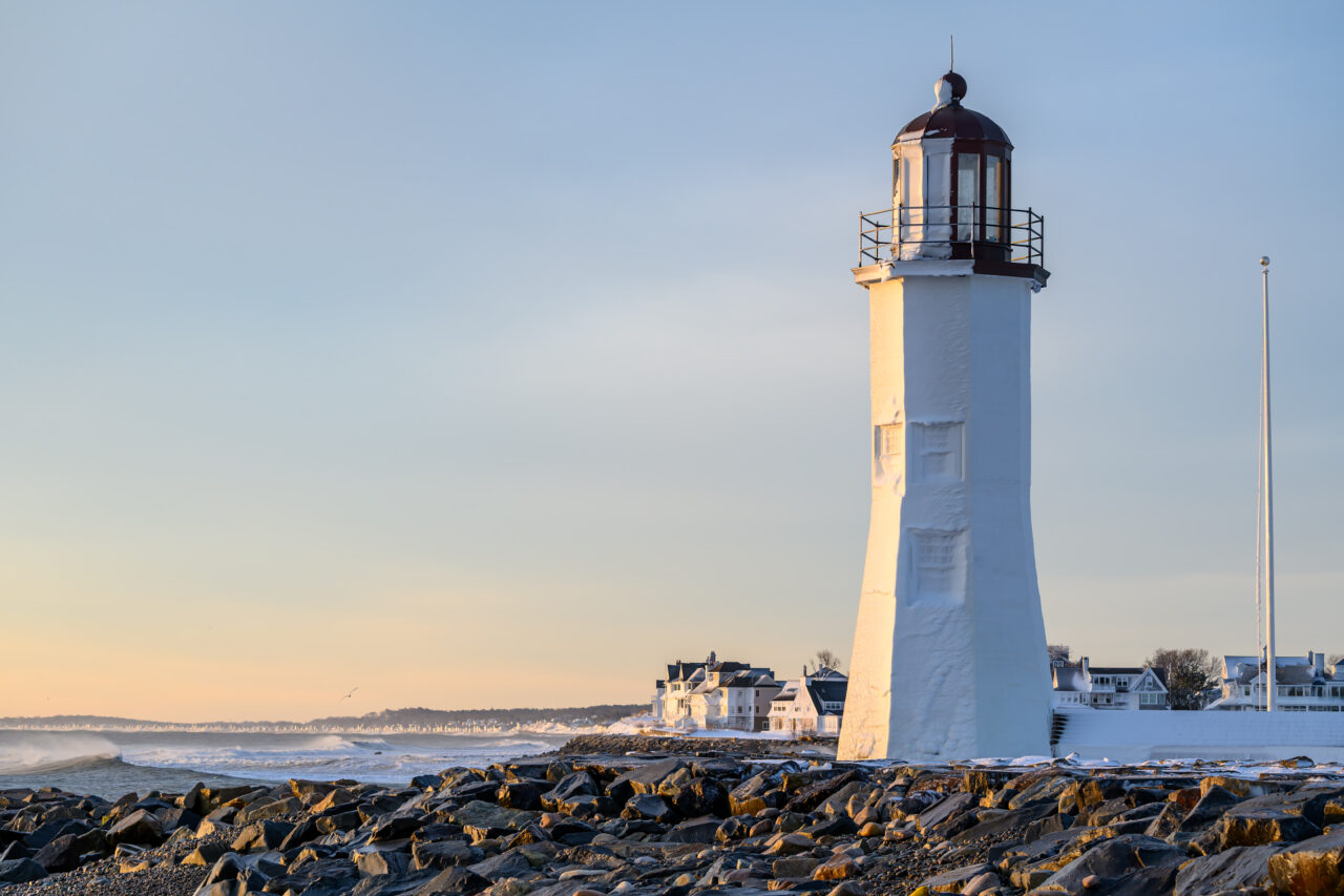 Old Scituate Light caked in frozen spray after the 2026 blizzard.