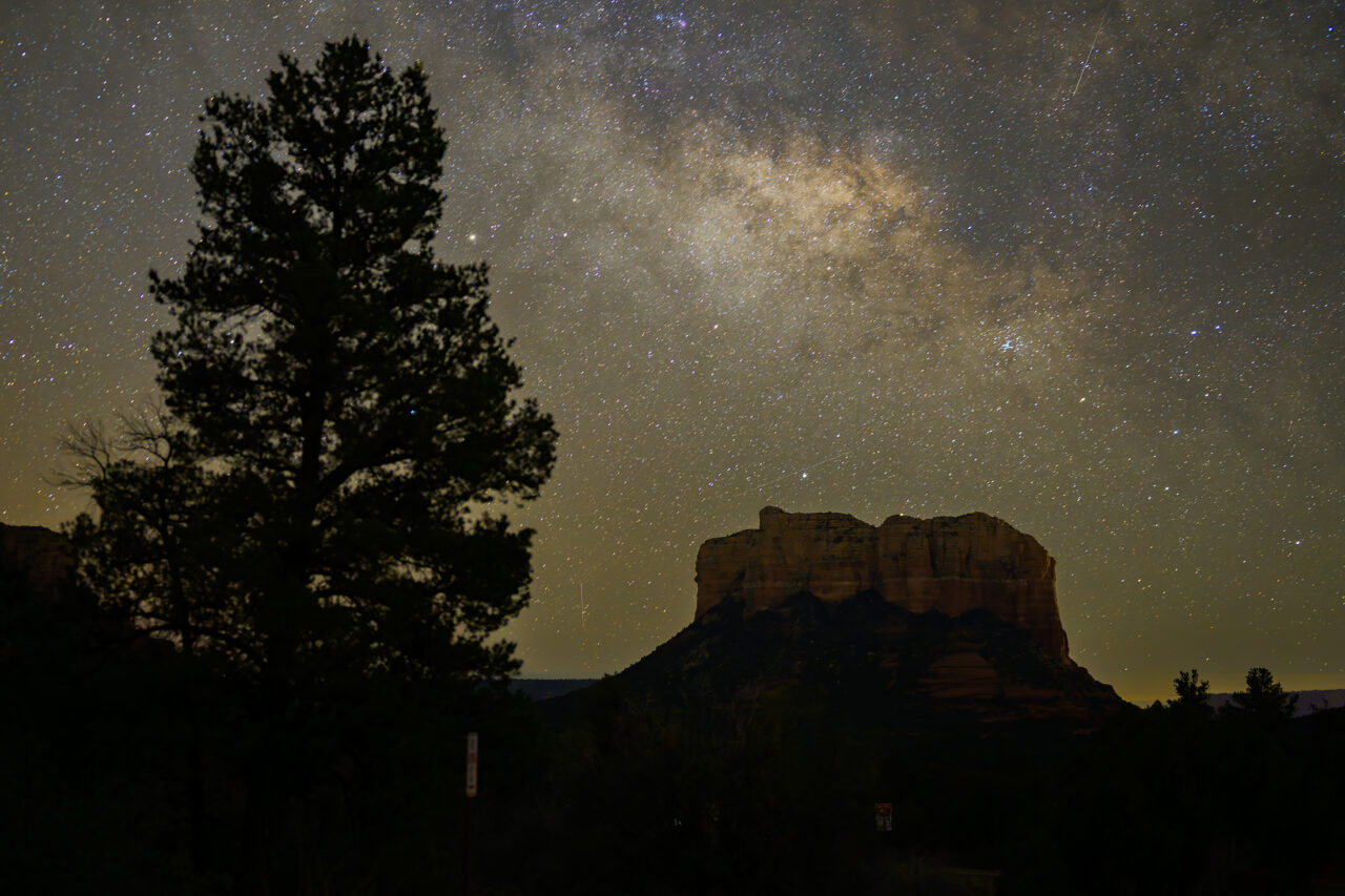 The brilliant Milky Way galaxy stretching over the silhouette of Courthouse Butte in Sedona.