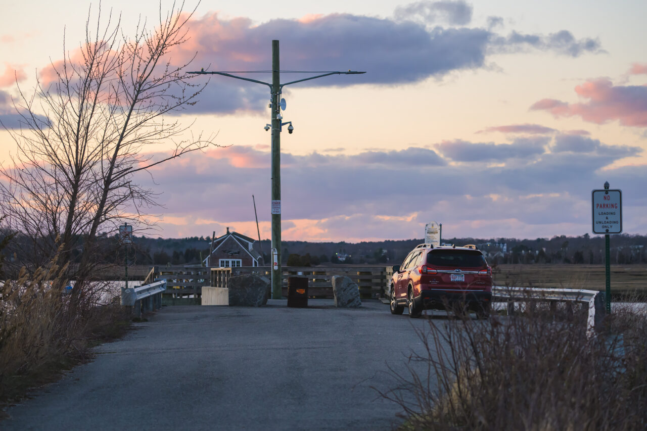 The boat launch at Damon's Point at dusk with pink clouds overhead.