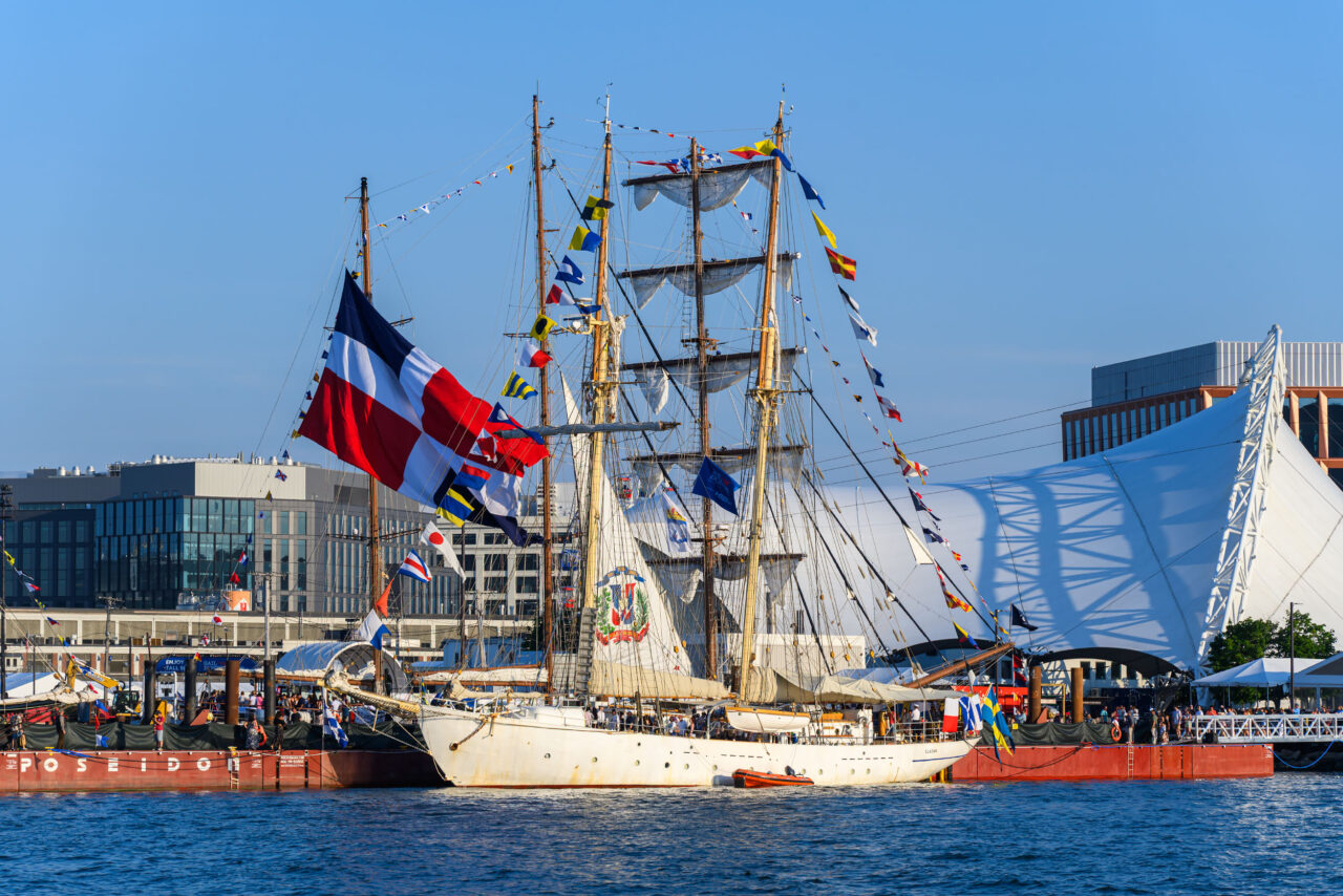 Sweden's HMS Gladan tall ship docked among the Sail Boston fleet.