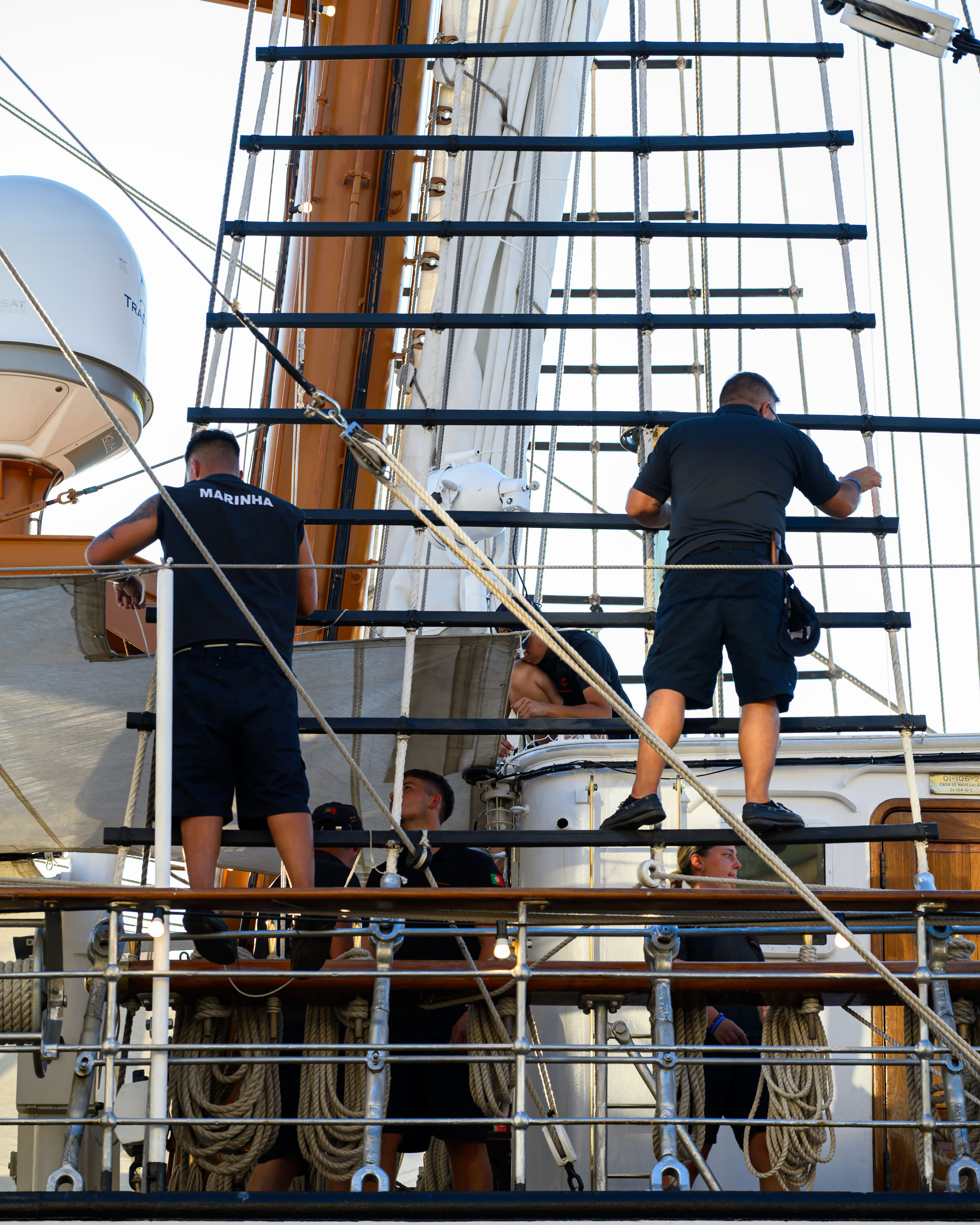 Crew members working on the rigging aboard the Sagres tall ship